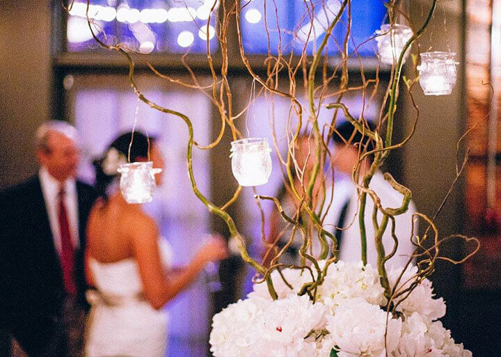 White candles on a tree event decor